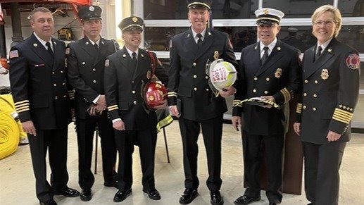 Belleville Fire Department's Deputy Chief Curt Lougeay, Engineer Meloan, Captain Owens, Battalion Chief Ellison, Assistant Chief Garnica, and Chief Stephanie Mills