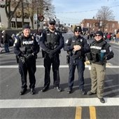 Belleville Police officers pose for photo at 2023 Santa Parade