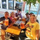 Oktoberfest in Belleville, IL. A group raises their glasses of beer in a toast.