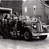 Historic Belleville Fire Department photograph of firemen in front of a vintage fire truck.