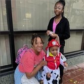 A family poses in Halloween costumes at the 2023 Trick or Treat event in Downtown Belleville