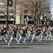 Parade participants perform a dance during Belleville's 2023 Santa Parade