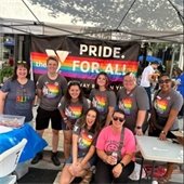Booth attendants pose for photo at the Metro East Pride Fest