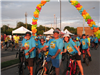 Founders of Tour de Belleville on bikes wearing blue t-shirts