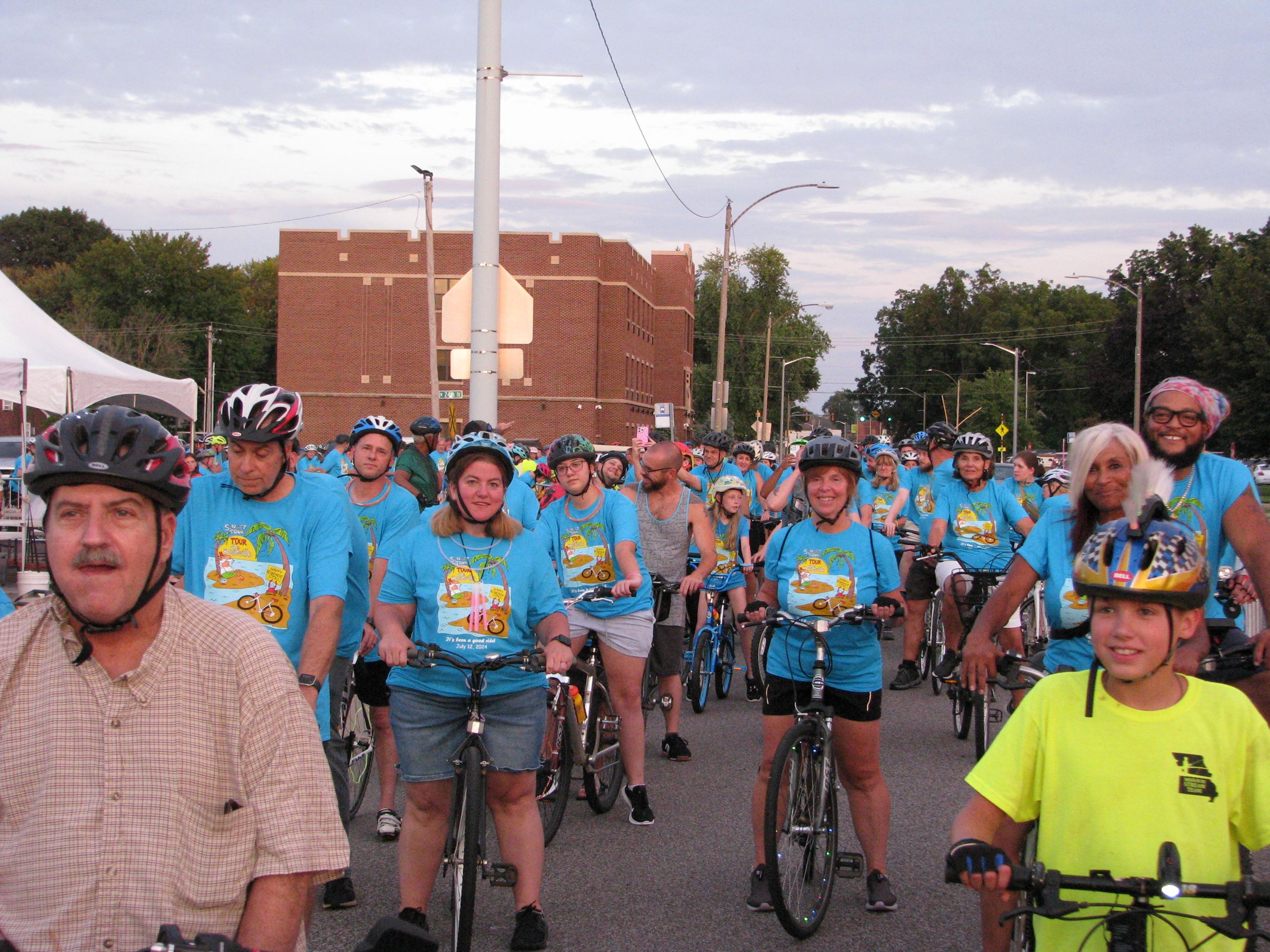 Group of bike riders in blue t-shirts